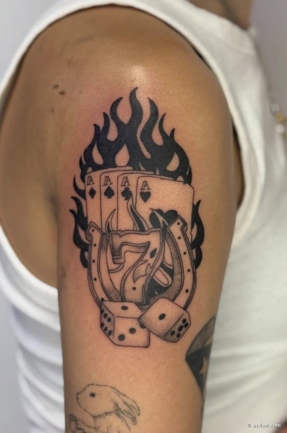 Cards, dice & flame — blackwork tattoo — by Bianca Finzi, Austin TX