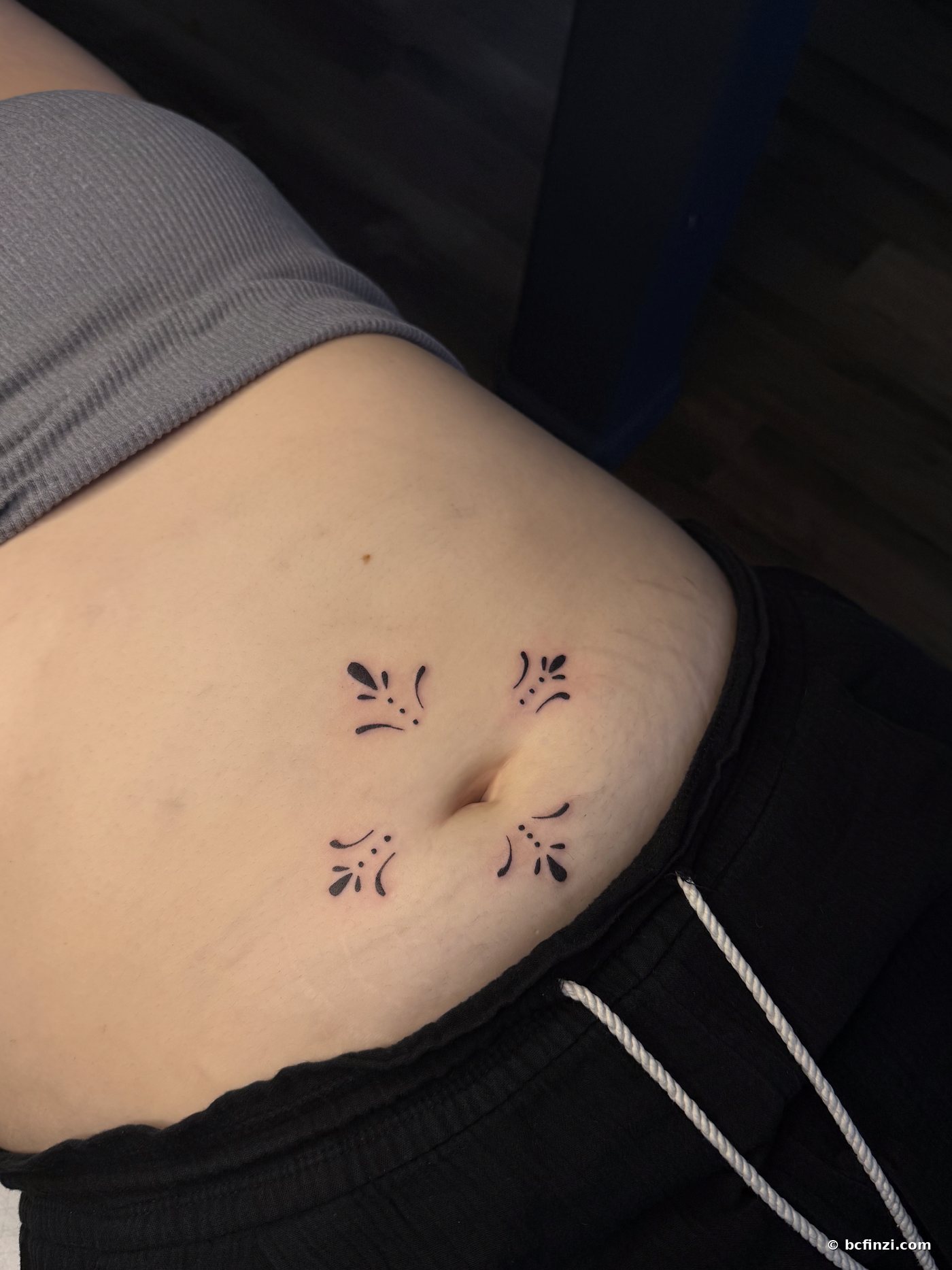 Ornamental flourishes — ornamental tattoo — on the stomach — by Bianca Finzi, Austin TX